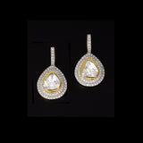 Diamond Polki Drop Earrings Designed to captivate, these drop earrings showcase luminous Diamond Polki framed by brilliant round diamonds, creating a graceful silhouette with modern sophistication and effortless sparkle.(KME2544)