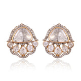 A graceful fusion of Polki and brilliant diamonds, these statement earrings celebrate timeless elegance with a contemporary silhouette.(KME2557)