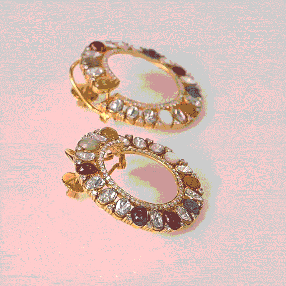 Inspired by tradition, these Navratan and Polki diamond earrings bring vibrant colour, elegance, and timeless charm to every look.(KME2559)