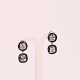 A striking harmony of natural Polki diamonds and calibre-cut blue sapphires, crafted into graceful statement earrings.(KME2562)