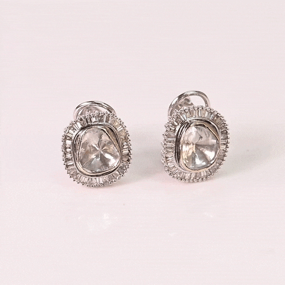 A graceful fusion of natural (Polki and brilliant baguette diamonds, designed to elevate every occasion with timeless beauty.(KME2564)