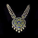 Elegant long necklace featuring rich blue enamel detailing, adorned with gold and uncut diamond polki floral motifs, gracefully strung with lustrous pearls in gold wire, creating a timeless blend of tradition and sophistication. (KMNE3371)