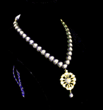 Elegant single-line necklace with matching earrings, featuring a delicate pendant, blue enameled detailing, and sparkling diamond Polki. A perfect fusion of tradition and style for graceful, standout occasions.(KMNE3466) + (kme2332)