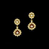 Radiate regal charm with this stunning red enameled necklace and earring set, intricately crafted with uncut diamonds. A perfect blend of heritage and glamour for festive occasions and bridal elegance. (KMNE3553)