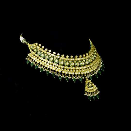Royal Green Meenakari Polki Set A majestic green meenakari necklace with diamond polki, emerald bead and pearl hangings, paired with elegant earrings for timeless bridal grandeur and royal sophistication.(KMNE3568)