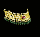 Grace your neckline with this elegant white choker necklace and tops set, featuring uncut diamonds and a striking center pink stone. A refined choice for contemporary brides and festive wear.(KMNE3576)