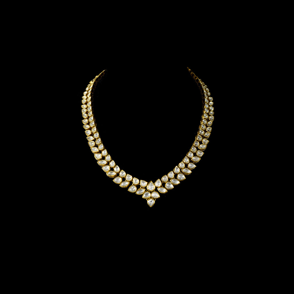 Elegant and timeless, this white two-line connected long necklace and earring pair features dazzling uncut diamonds. Perfect for adding grace and sparkle to weddings, festive events, or special celebrations.(KMNE3590) + (KME2373)