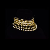 Elevate your style with this stunning semi-choker necklace and earring pair, featuring dazzling uncut diamond polki and a striking larger center stone, beautifully strung with pearls. Perfect for adding royal charm to any special occasion.(KMNE3611)