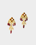 A striking necklace and earring set adorned with diamond polki and rich ruby stones, strung with ruby maniya and pearls. A timeless expression of heritage artistry and refined luxury, perfect for festive and celebratory moments. (KMNE3637)
