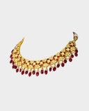 A striking necklace and earring set adorned with diamond polki and rich ruby stones, strung with ruby maniya and pearls. A timeless expression of heritage artistry and refined luxury, perfect for festive and celebratory moments. (KMNE3637)