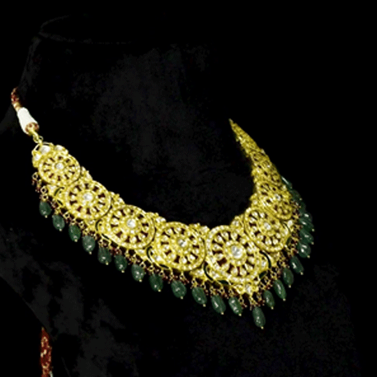 Royal Polki Bridal Necklace Set A magnificent diamond polki necklace featuring ruby detailing, emerald bead hangings, and matching statement earrings—crafted for timeless bridal elegance with regal heritage appeal.(KMNE3643)