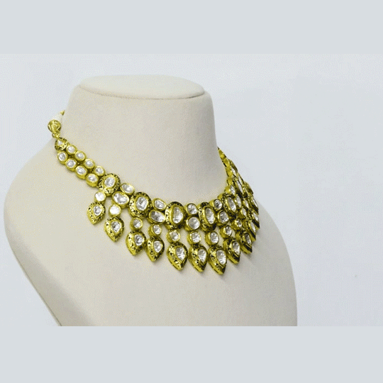 A timeless Partash work necklace with hand-set diamond polki, showcasing intricate craftsmanship and old-world elegance. Celebrating heritage artistry, this statement piece adds regal charm to weddings and festive occasions. (KMNE3644)
