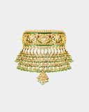 A traditional Rajasthani aad necklace and earring set crafted with diamond polki, accented by rich green stones and pearl stringing. An opulent expression of royal heritage and timeless bridal elegance. (KMNE3663)
