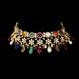 A breathtaking fusion-style Navratan necklace adorned with sparkling Polki diamonds, brilliant round diamonds, vibrant Navratan gemstones, and elegant pearls, crafted to celebrate timeless royalty, color, and unmatched festive glamour.(KMNE3716)