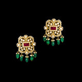 A fusion Navratan choker featuring polki diamonds in gold, highlighted with a central ruby, multicolored gemstones, intricate pearl detailing, and cascading emerald drops—paired with statement earrings for a rich, regal presence. (KMNE3719)