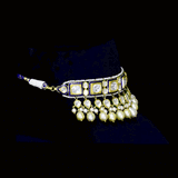 A regal blue enamelled choker set in gold, showcasing bold oversized polki diamonds framed with intricate detailing, finished with cascading South Sea pearl fringes and perfectly matched statement earrings for timeless grandeur. (KMNE3720)