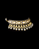 A regal blue enamelled choker set in gold, showcasing bold oversized polki diamonds framed with intricate detailing, finished with cascading South Sea pearl fringes and perfectly matched statement earrings for timeless grandeur. (KMNE3720)