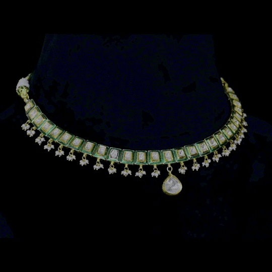 A refined single-line gold necklace set featuring polki diamonds with green enamel detailing, accented by delicate pearl hangings, paired with matching earrings—perfectly blending traditional elegance with understated, modern sophistication. (KMNE3722)