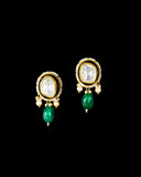 A majestic choker showcasing large polki diamonds set in striking green-enamelled gold, layered with intricate detailing, finished with cascading emerald drops and pearl fringes—opulent, bold, and exquisitely regal. (KMNE3724)