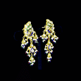 Grand statement necklace and earring pair featuring intricate peacock meenakari in vibrant hues, adorned with uncut diamond polki, highlighted by cascading multicolor beads with pearls, reflecting regal artistry and timeless bridal elegance. (KMNE3743)