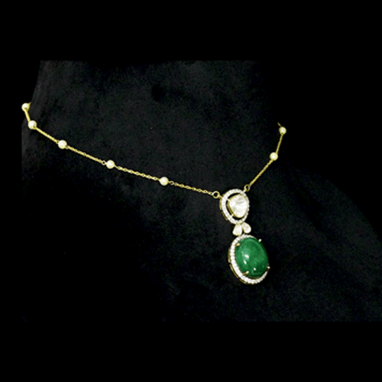 Diamond Polki & Emerald Pendant A graceful pendant featuring diamond polki, brilliant round diamonds, a striking emerald cabochon, and a delicate gold chain accented with elegant pearls for timeless sophistication.(KMNE3744)