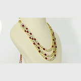 Ruby & Diamond Polki Three-Line Necklace Set Grace your celebrations with this elegant three-line necklace and earrings, featuring vibrant rubies, shimmering diamond polki, and timeless craftsmanship for sophisticated traditional luxury.(KMNE3751)