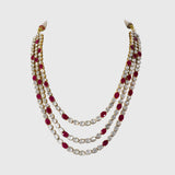 Ruby & Diamond Polki Three-Line Necklace Set Grace your celebrations with this elegant three-line necklace and earrings, featuring vibrant rubies, shimmering diamond polki, and timeless craftsmanship for sophisticated traditional luxury.(KMNE3751)