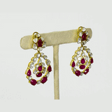 Ruby & Diamond Polki Three-Line Necklace Set Grace your celebrations with this elegant three-line necklace and earrings, featuring vibrant rubies, shimmering diamond polki, and timeless craftsmanship for sophisticated traditional luxury.(KMNE3751)
