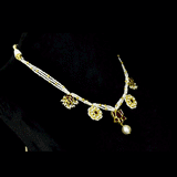 Traditional Diamond Polki & Ruby Necklace Set Celebrate timeless elegance with this traditional necklace and tops, featuring diamond polki, vibrant ruby accents, delicate pearl stringing, and exquisite handcrafted heritage-inspired artistry.(KMNE3753)