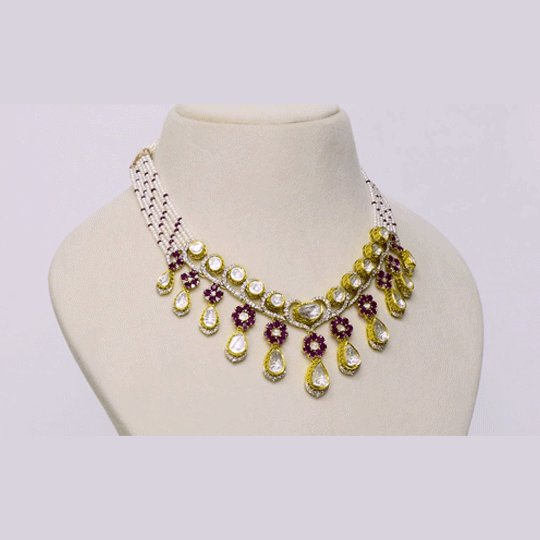 A graceful fusion necklace with diamond polki, round diamonds, vibrant rubies, and elegant pearl stringing, paired with matching earrings for timeless sophistication and charm.(KMNE3759)