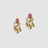 A graceful fusion necklace with diamond polki, round diamonds, vibrant rubies, and elegant pearl stringing, paired with matching earrings for timeless sophistication and charm.(KMNE3759)