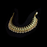 Green Enamelled Diamond Polki Necklace Set Traditional green enamelled necklace set adorned with sparkling diamond polki and delicate pearl hangings, paired with matching earrings for timeless elegance and festive charm.(KMNE3766)
