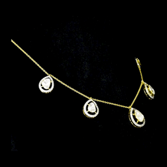 Delicate pear-shaped diamond Polki gracefully framed by shimmering round diamonds, creating a timeless station necklace with effortless elegance and brilliance.(KMNE3775)