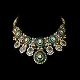 Inspired by royal artistry, this fusion necklace set combines dazzling diamond Polki, brilliant round diamonds, vibrant emeralds, and intricate floral craftsmanship for an effortlessly luxurious statement.(KMNE3782)