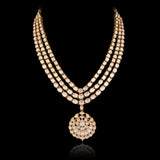 A masterpiece of traditional craftsmanship, this three-line Polki necklace with pendant and earrings radiates enduring elegance and royal charm.(KMNE3785)