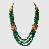 Three strands of vibrant emerald maniya paired with red meenakari diamond Polki motifs create a timeless necklace blending royal heritage with contemporary elegance beautifully.(KMNE3786)
