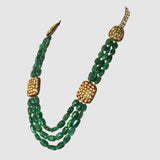 Three strands of vibrant emerald maniya paired with red meenakari diamond Polki motifs create a timeless necklace blending royal heritage with contemporary elegance beautifully.(KMNE3786)