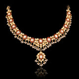 Grace every celebration with this handcrafted red meenakari necklace and earrings, featuring natural Polki diamonds and pearl accents.(KMNE3790)