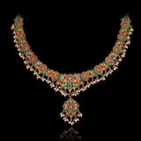 Grace every celebration with this handcrafted red meenakari necklace and earrings, featuring natural Polki diamonds and pearl accents.(KMNE3790)