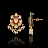 Grace every celebration with this handcrafted red meenakari necklace and earrings, featuring natural Polki diamonds and pearl accents.(KMNE3790)