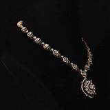 A striking fusion of heritage and modern glamour, this Polki diamond necklace set shines with brilliant diamonds and elegant green stones.(KMNE3791)