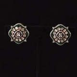 A striking fusion of heritage and modern glamour, this Polki diamond necklace set shines with brilliant diamonds and elegant green stones.(KMNE3791)