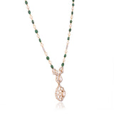 Grace your celebrations with this exquisite Diamond Polki necklace and earrings, accented with brilliant diamonds, emerald maniya, and delicate pearls.(KMNE3792)