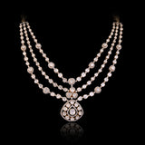 Three radiant strands of handcrafted Diamond Polki, highlighted by shimmering round diamonds and a statement pendant of timeless beauty.(KMNE3793)