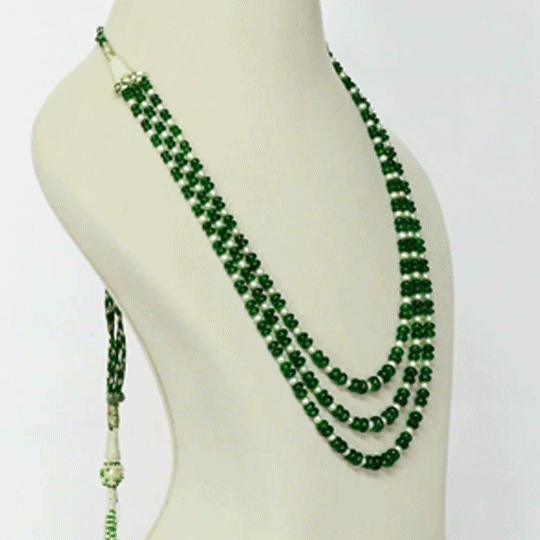 Three graceful strands of vibrant emerald beads, accented with lustrous pearls, create a timeless necklace that embodies refined luxury and effortless sophistication.(KMPE1197)