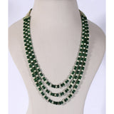 Three graceful strands of vibrant emerald beads, accented with lustrous pearls, create a timeless necklace that embodies refined luxury and effortless sophistication.(KMPE1197)