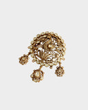 A diamond polki and round brilliant diamond pendant in an open setting that enhances brilliance. Finished with antique gold polish and paired with a delicate gold chain, it reflects timeless craftsmanship and understated elegance. (KMPE1320)