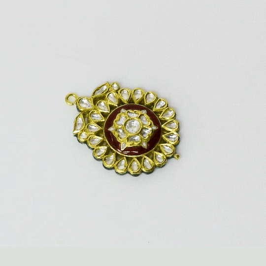 A simple red meena pendant accented with diamond polki, reflecting timeless elegance and refined traditional craftsmanship. (KMPE1352)