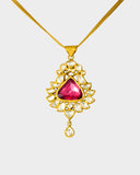 An elegant pendant featuring diamond polki with a striking central tourmaline, blending classic craftsmanship with vibrant colour for a timeless statement. (KMPE1353)
