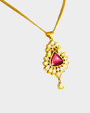 An elegant pendant featuring diamond polki with a striking central tourmaline, blending classic craftsmanship with vibrant colour for a timeless statement. (KMPE1353)